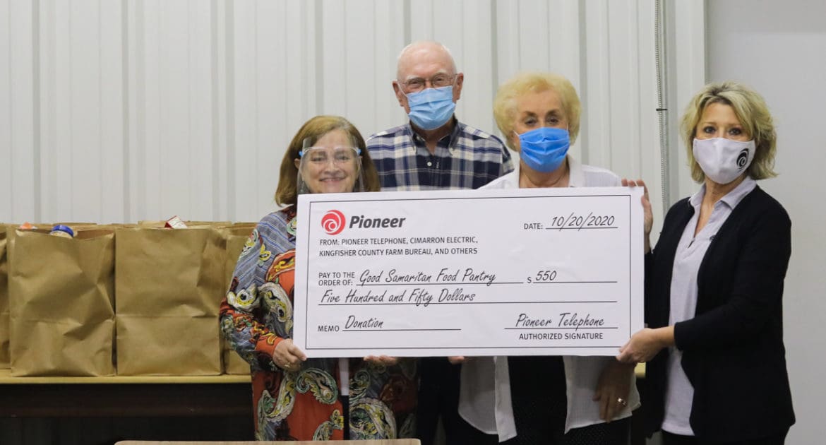 PIONEER TELEPHONE COOP PRESENTS CHECK TO METHODIST FOOD MINISTRY