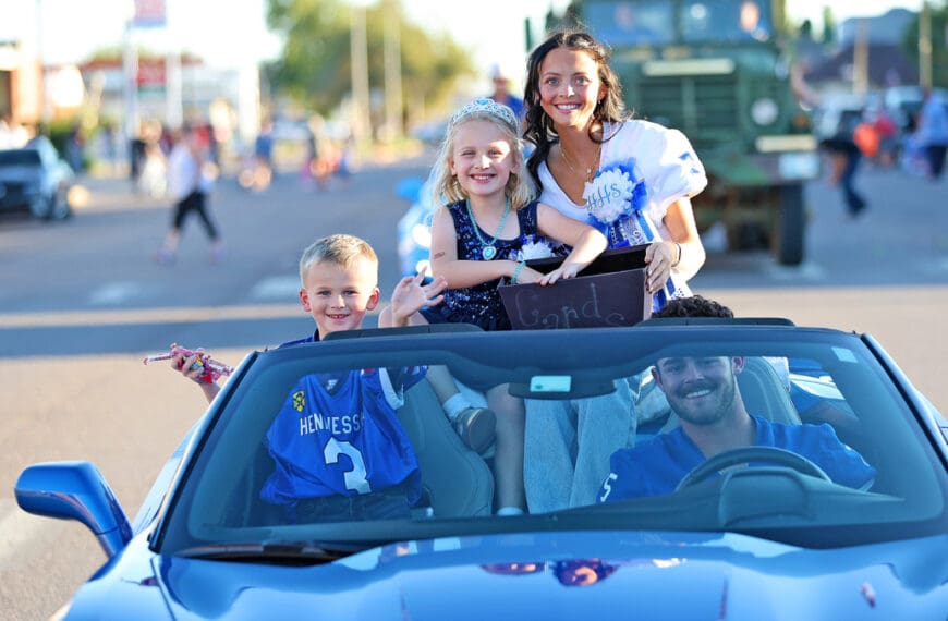 PARADING HOMECOMING COURT